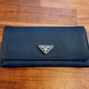 Authentic Prada continental wallet crafted in black Tessuto nylon with signature